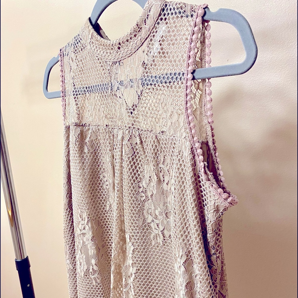Crochet lacy sleeveless top with two button keyhole back closure